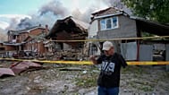 A homeowner reacts at his house, damaged in a Russian air attack near Kyiv,