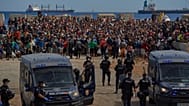 Migrants who crossed from Morocco into Spain return to a beach after being expelled from the area the previous day, 21 August, 2026