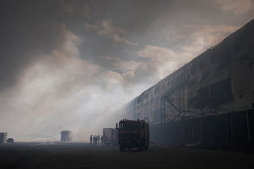 Smoke rises above warehouse stores after a Russian air attack in Kyiv, 27 August, 2026
