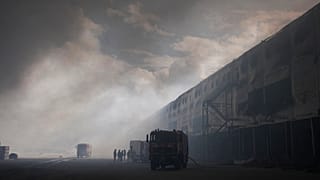 Smoke rises above warehouse stores after a Russian air attack in Kyiv, 27 August, 2026