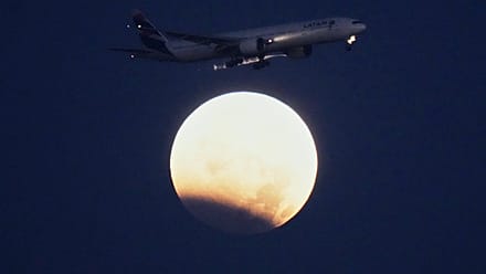 Near-total lunar eclipse as moon passes through Earth's shadow