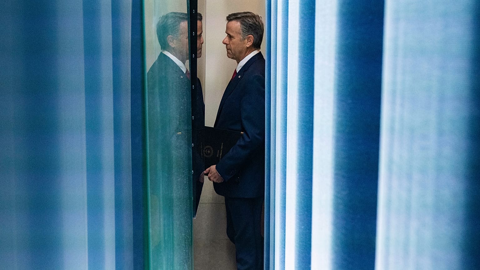 FILE: CIA Director John Ratcliffe arrives to speak with reporters in the James Brady Press Briefing Room at the White House, Monday, April 6, 2026, in Washington.