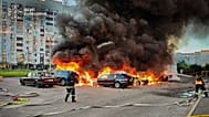 Cars burn as firefighters try to put out a fire following a Russian drone attack in Kyiv region, 28 August, 2026