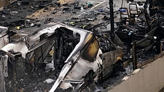 View of burnt ambulances in a car park at Golders Green in London, 23 March, 2026 