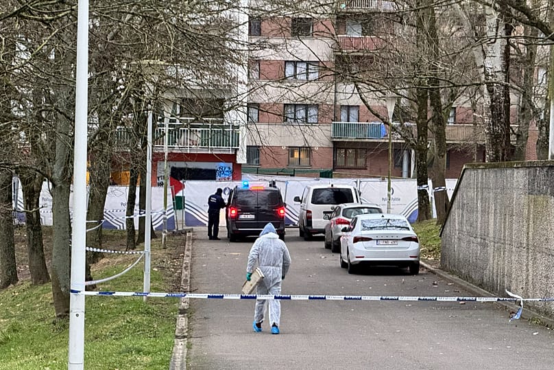 Police work in an area around an apartment complex after a shooting incident in Brussels, 7 February, 2025