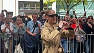 Céline Dion greets her fans and journalists as she arrives at the Royal Monceau hotel in Paris
