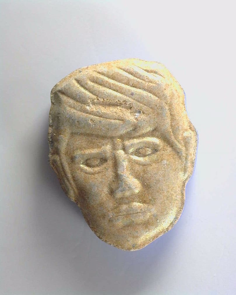 This undated photo provided by Trimbos Institute of Mental Health and Addiction shows pills that have a depiction of President Donald Trump on one side