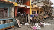 Residents salvage their belongings from damaged houses after flash flooding in the Devighat area of Nuwakot district in Nepal, 28 August, 2026