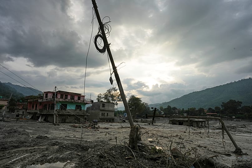 A damaged electric pole leans after flash flooding in the Devighat area of Nuwakot district in Nepal, 28 August, 2026