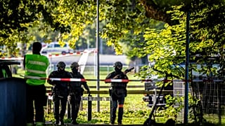 Police officers secure the area around the Schachen horse racing track following a shooting at a rave, in Aarau, Switzerland, Sunday Aug. 30, 2026. (Michael Buholzer/Keystone 