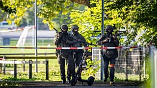 Armed police officers patrol near the Schachen horse racing track in Aarau, 30 August, 2026