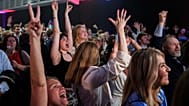 Supporters for the yes react as they watch partial referendum results during an election-night gathering in Reykjavik