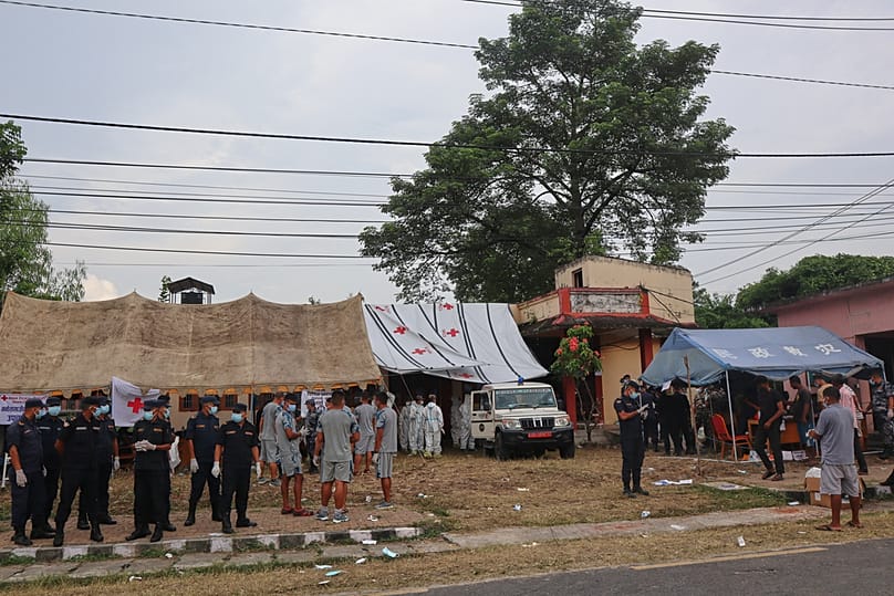 Rescuers carry bodies of flash flood victims for a mass burial, in Chitwan, Nepal, Saturday, 29 August, 2026