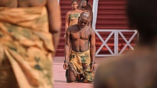 Members of the University of Ghana School of Performing Arts reenact the slave trade at Christiansborg Castle in Accra, 19 June, 2026