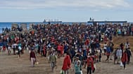 Migrants who crossed from Morocco into Spain return to a beach after being expelled from the area the previous day, 21 August, 2026