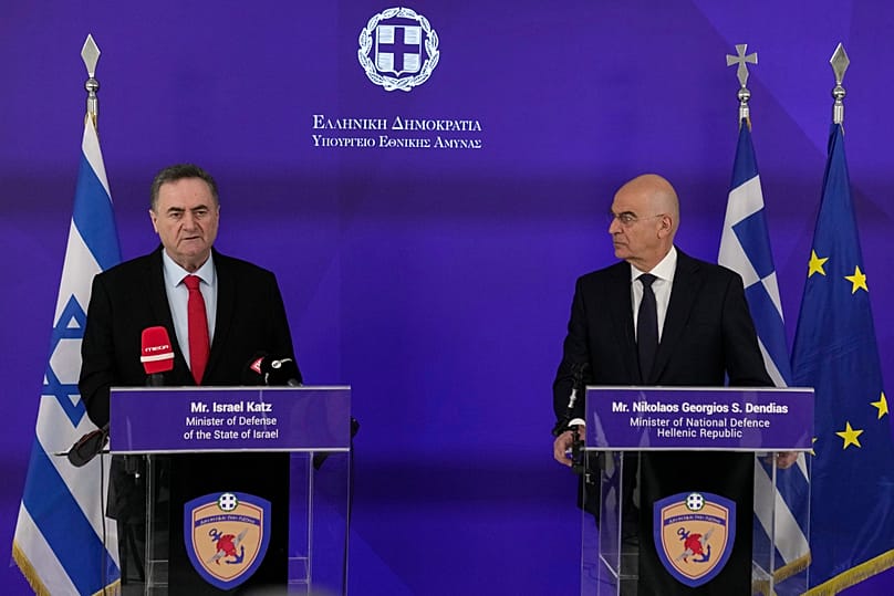 Greek Defence Minister Nikos Dendias, right, and his Israeli counterpart Israel Katz speak in Athens, 20 January, 2026
