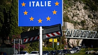 Cars line up for police checks before entering France from Italy at a border crossing in Menton, 13 November, 2022