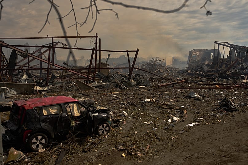 Destroyed vehicles and debris are scattered the day after a Russian attack struck a warehouse in the village of Myla, 30 August, 2026