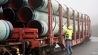 FILE - An employee works on pipes for connecting the Brunsbuettel LNG terminal to the German gas network in Brunsbuettel, Germany, Monday, 6 Feb. 2023. 