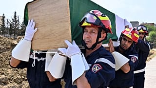 People take part in a burial ceremony for victims of wildfires, in the Djemaa Beni Habibi town in Jijel, Algeria, Friday, Aug. 28, 2026. 
