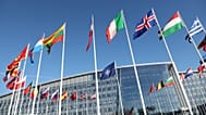 Flags flap in the wind outside NATO headquarters in Brussels, Belgium, 4 April 2023. 