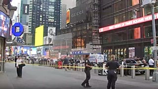 NYPD officers on the scene after a woman brandishing two large knives was shot by officers in Times Square in New York City, Monday, Aug. 31, 2026