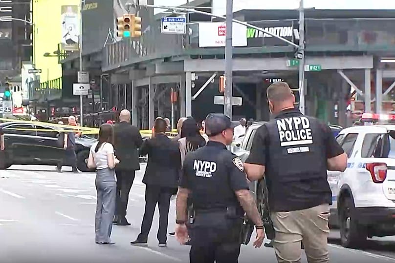 NYPD officers on the scene after a woman brandishing two large knives was shot by officers in Times Square in New York, Monday, Aug. 31, 2026