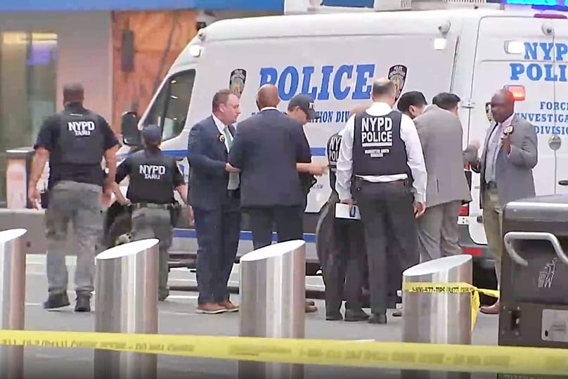 NYPD officers on the scene after a woman brandishing two large knives was shot by officers in Times Square in New York, Monday, Aug. 31, 2026