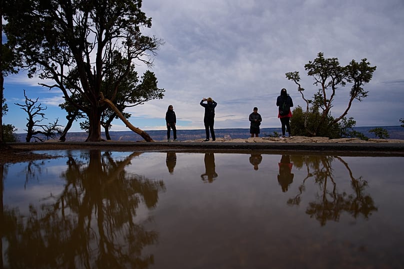 People stand at the rim of the Grand Canyon, 31 August, 2026