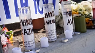 Candles with victims names are placed outside the Islamic Centre of San Diego in the aftermath of a shooting, 20 May, 2026