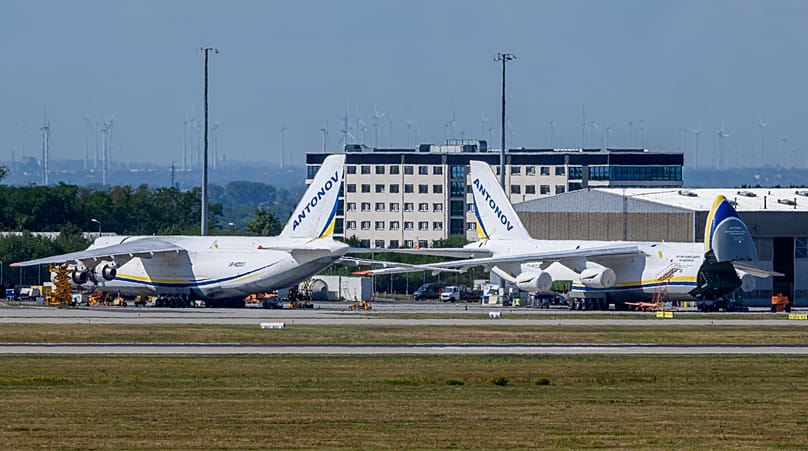 Ukrainian Antonov aircrafts are parked behind a fence on the grounds of Leipzig/Halle Airport, 6 August, 2026