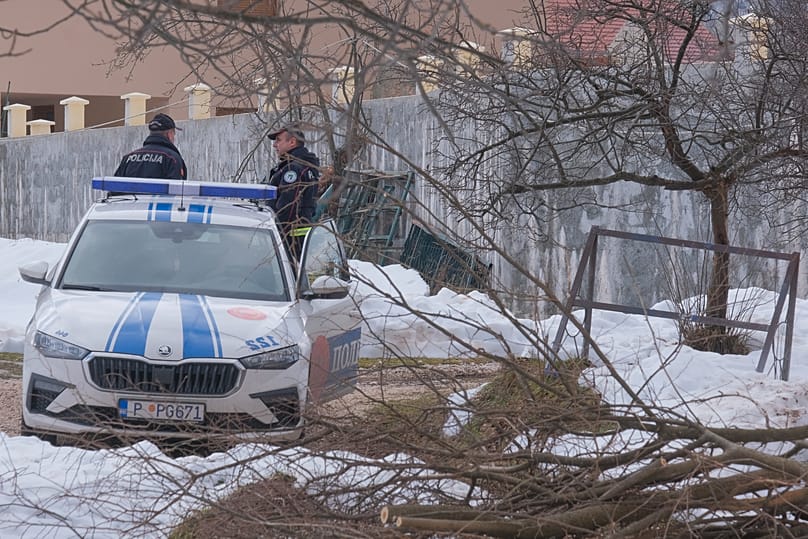 Police officers stand guard west of Podogrica, 2 January, 2025