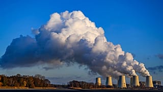 Steam rises from the cooling towers of the Jänschwalde power plant, 26 November, 2024