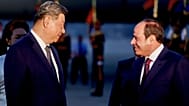 Chinese President Xi Jinping is welcomed by Egyptian President Abdel-Fattah el-Sisi upon his arrival at Cairo International Airport for an official visit to Egypt,