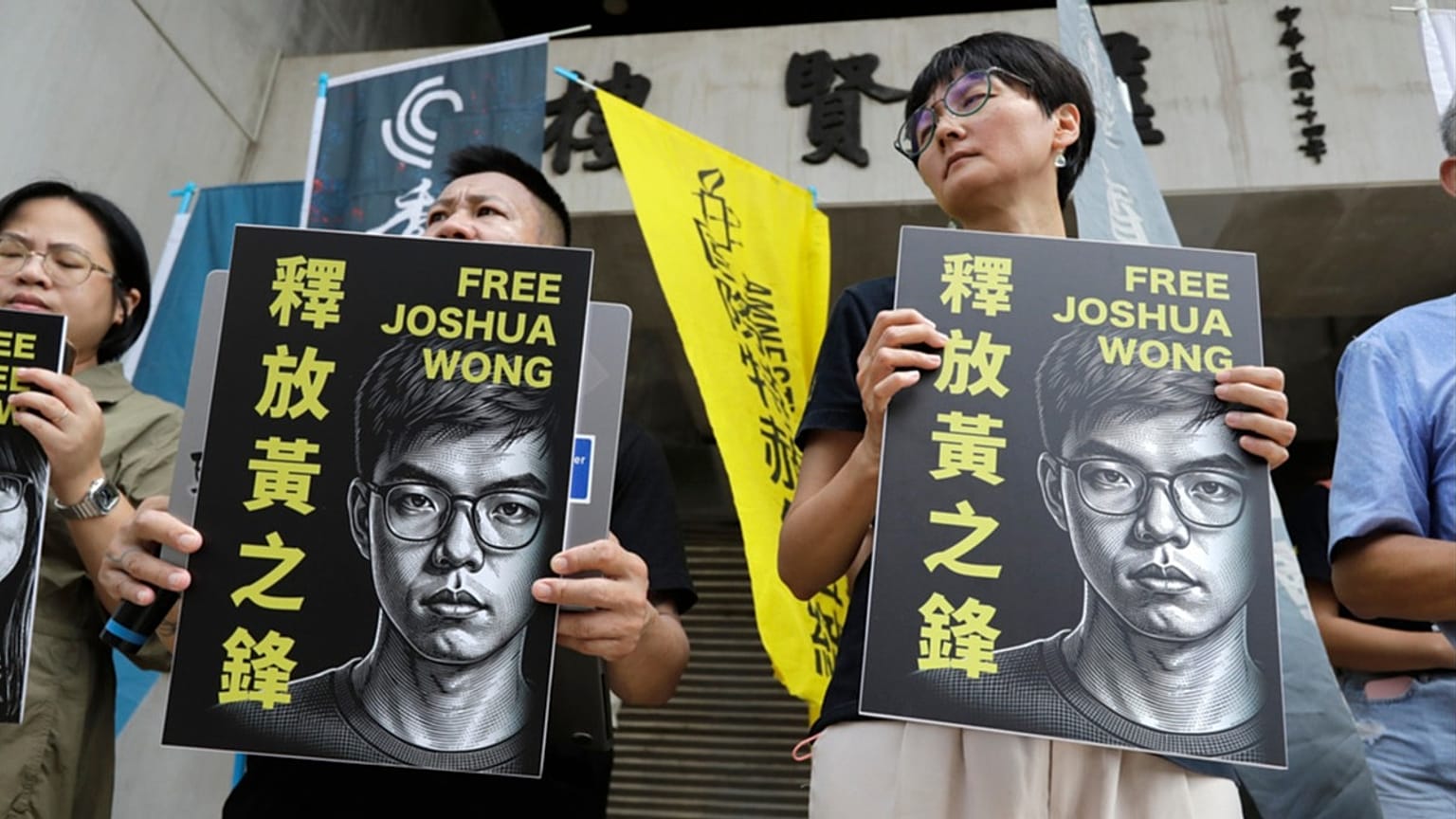 Hong Kong activist and supporters hold signs during a press event to support pro-democracy activist Joshua Wong in Taipei, Taiwan, Wednesday, 2 September, 2026