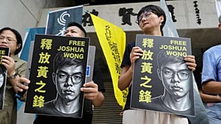 Hong Kong activist and supporters hold signs during a press event to support pro-democracy activist Joshua Wong in Taipei, Taiwan, Wednesday, 2 September, 2026