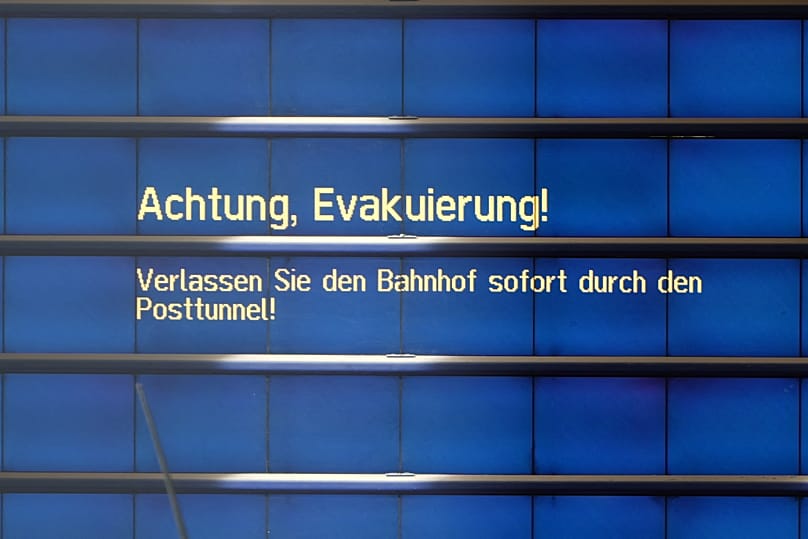 "Attention: Evacuation! Please leave the station immediately via the Post Tunnel!" reads a message on a monitor at Augsburg Central Station in Augsburg, 2 September, 2026