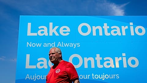 FILE - Ontario Premier Doug Ford unveils a sign for Lake Ontario at Fifty Point Conservation Area in Grimsby, Ontario, Canada, on Saturday, Aug. 29, 2026. 