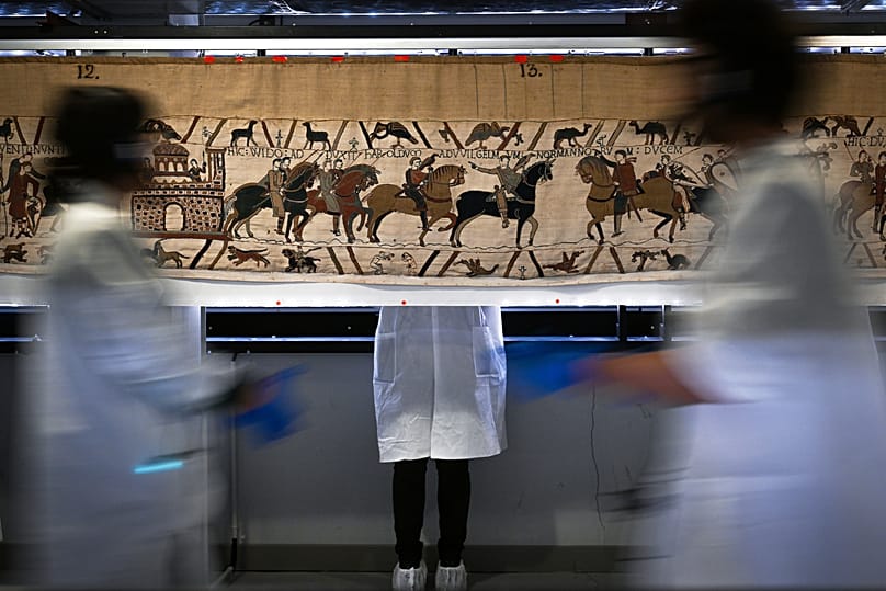 Workers and volunteers prepare to pack the Bayeux tapestry to transfer to the British Museum, 18 September, 2025