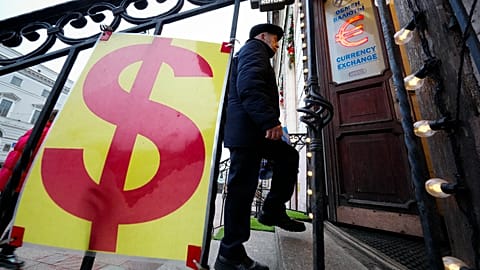 FILE: A man enters a currency exchange office in St Petersburg, 28 December 2024