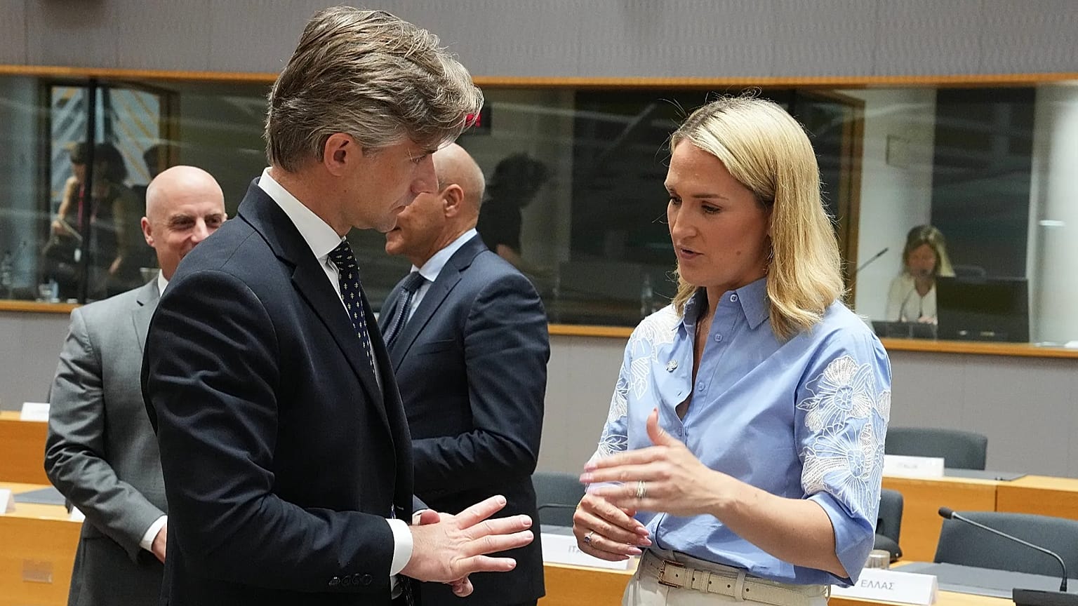 Lithuania's Foreign Minister Kestutis Budrys speaks with Ireland's Foreign Minister Helen McEntee during a round table meeting of EU foreign ministers in Brussels.