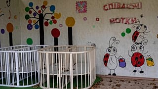 FILE: Empty cribs at a playhouse in the courtyard of Kherson regional children's home in Kherson, southern Ukraine, Friday, Nov. 25, 2022. 