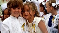 Kyiv children began the new school year with a ceremony interrupted by an air raid alert, hours after Russian missile strikes hit the capital.