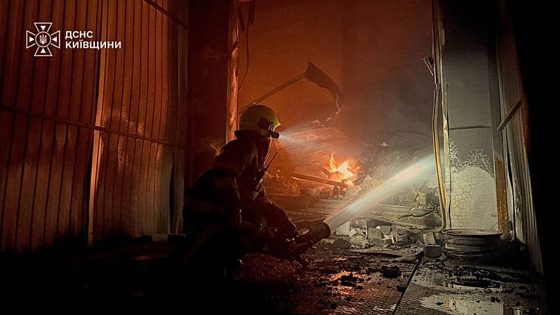 Firefighters put out a fire in a warehouse following a Russian drone attack near Kyiv, 2 September, 2026