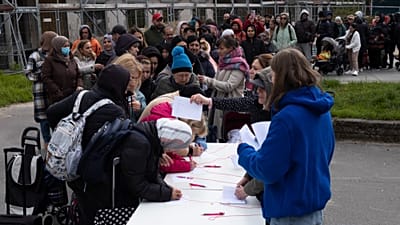File - Hundreds of people queue for food packages distributed by aid organisation Die Arche in Berlin, Germany, on 26 April 2023.