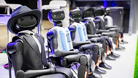 Robots from the company Booster sit on a small soccer field during the second press day of the IFA 2026 consumer electronic fair, IFA, in Berlin Thursday, Sept. 3, 2026.