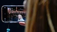 Brothers of Italy's Giorgia Meloni snaps a selfie movie during the center-right coalition closing rally in Rome Thursday, Sep. 22, 2022