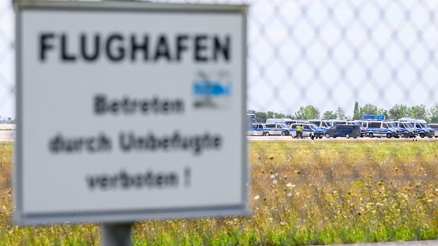 Police vehicles at Leipzig/Halle Airport, where investigations are underway following the drone incident in Schkeuditz, Germany, Thursday Aug. 6, 2026.