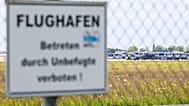 Police vehicles at Leipzig/Halle Airport, where investigations are underway following the drone incident in Schkeuditz, Germany, Thursday Aug. 6, 2026.