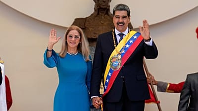 FILE - Venezuelan President Nicolas Maduro and his wife Cilia Flores wave after his swearing-in ceremony for a third presidential term, Caracas, Venezuela, on Jan. 10, 2025